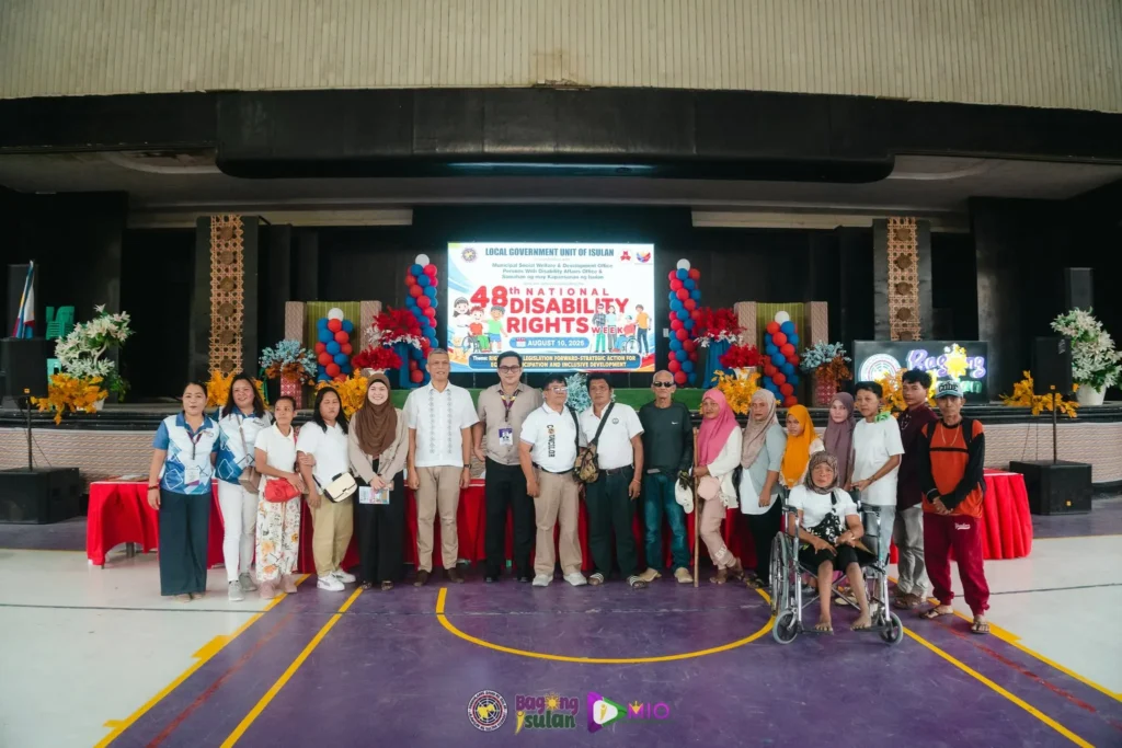 PWD representatives and community advocates pose during National Disability Rights Week in Isulan