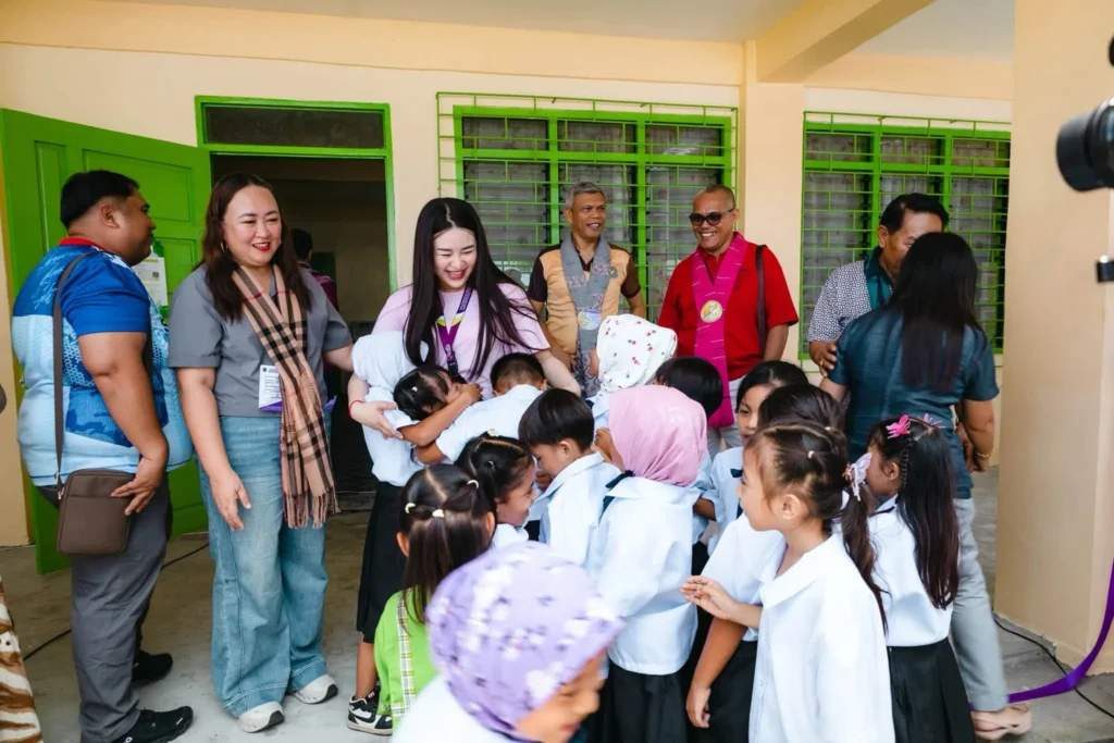 Students and officials during school building turnover ceremony in Isulan